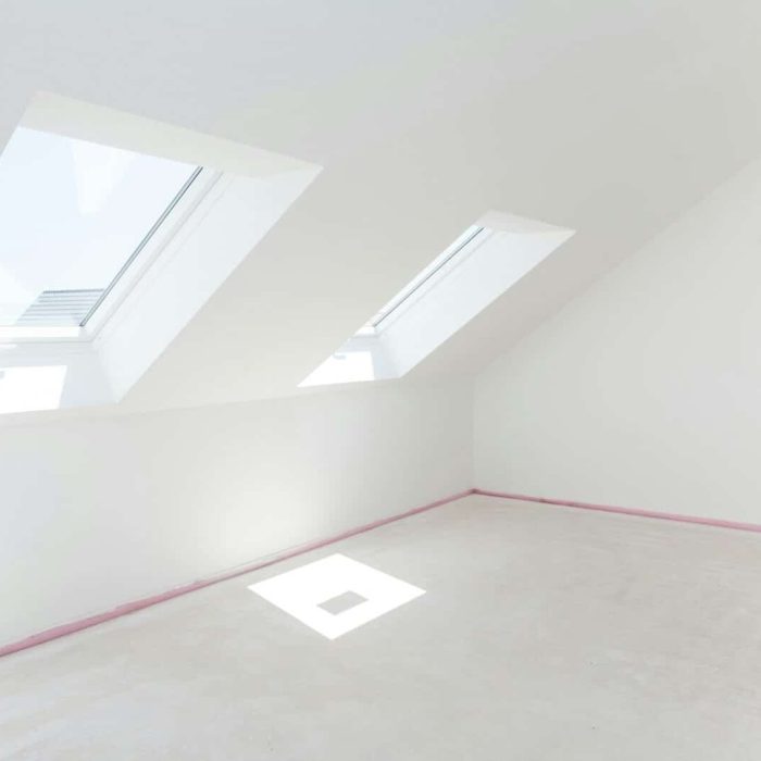 Loft refurbishment - empty room with skylight ready for renovation and new floor